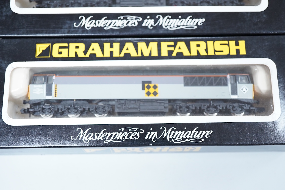 Four boxed Graham Farish N gauge railway class 56 diesel locomotives; a Load Haul, 56055, (805D), an EWS, British Fuels 56057 (805E), a Coal Sector, 56 092, (8057) and a Construction Sector, 56 059 (8056).